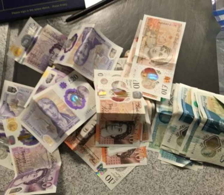 Over £10,000 in cash was seized by the police. Image Credit: Ealing Police