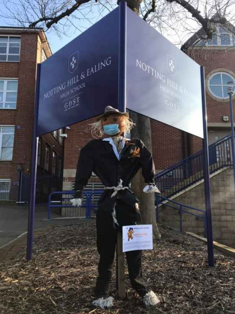 A scarecrow on display at the school's entrance