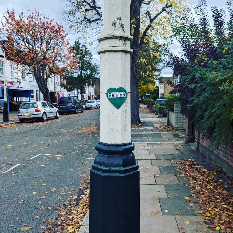 Mary put up 'Craftivism' signs to lift people's spirits last October. Image Credit: Mary Horesh