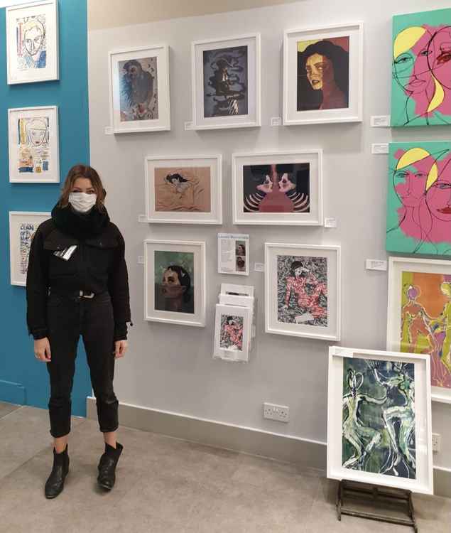 Lauren Mavromatis in front of her work at the Pop Up Gallery