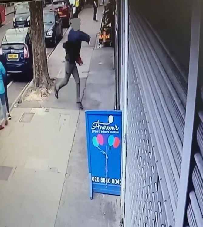 The man was caught on CCTV throwing what is believed to be a brick against shop windows. Image Credit: Amreen Malik