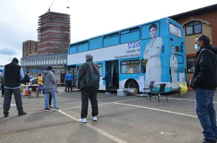 Ealing residents waiting to get their COVID jab at the vaccine bus in Southall in April. Image Credit: Ealing Council