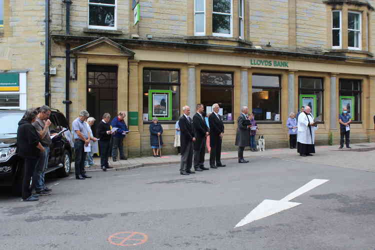 Team Rector the Reverend Clive Sedgewick conducts a short memorial service outside The Minster