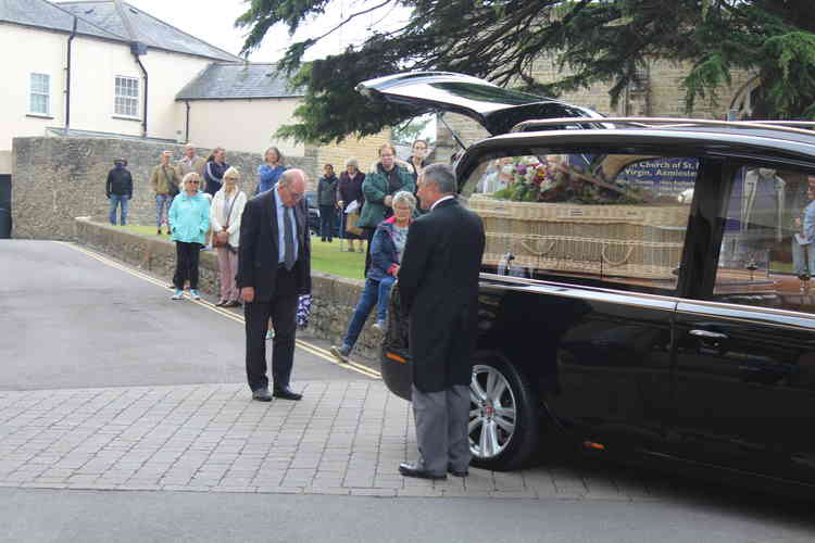 Former Axminster mayor Andrew Moulding pays his respects