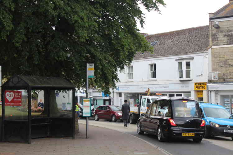 Thew coffin leaves Axminster via West Street