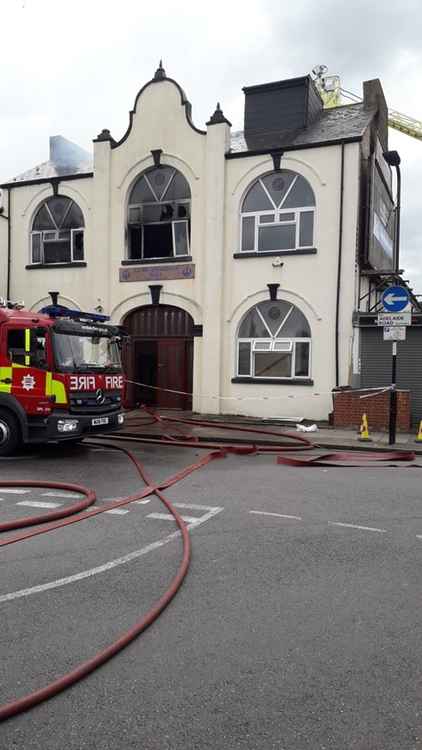 Part of the first floor and the roof of the building were set alight. Image Credit: London Fire Brigade