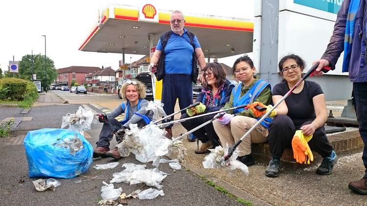 LAGER Can volunteers return plastic gloves to the Shell filling station. Credit Mark Percy