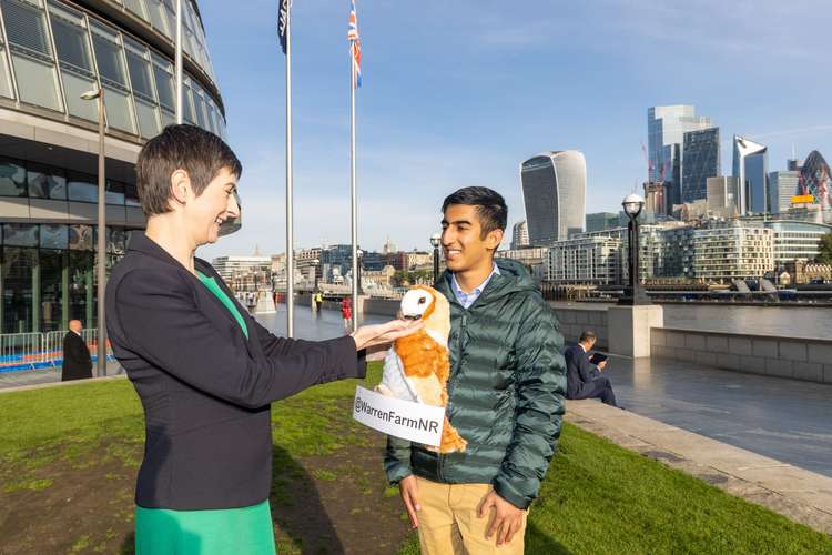 Caroline Pidgeon with Kabir Kaul. The petition was presented in the beak of a barn owl (Image: Warren Farm Nature Reserve)