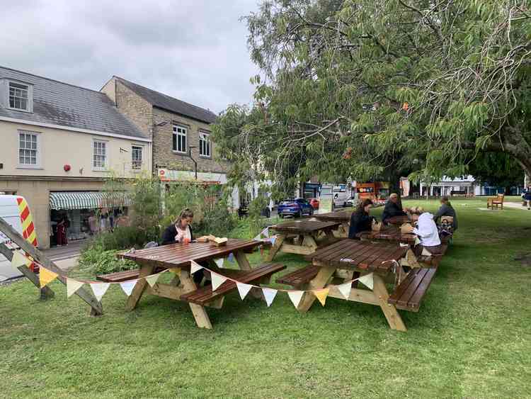 Specially made picnic benches made by Ian Styles of Axminster  Property on The Minster Green for Waffle House customers