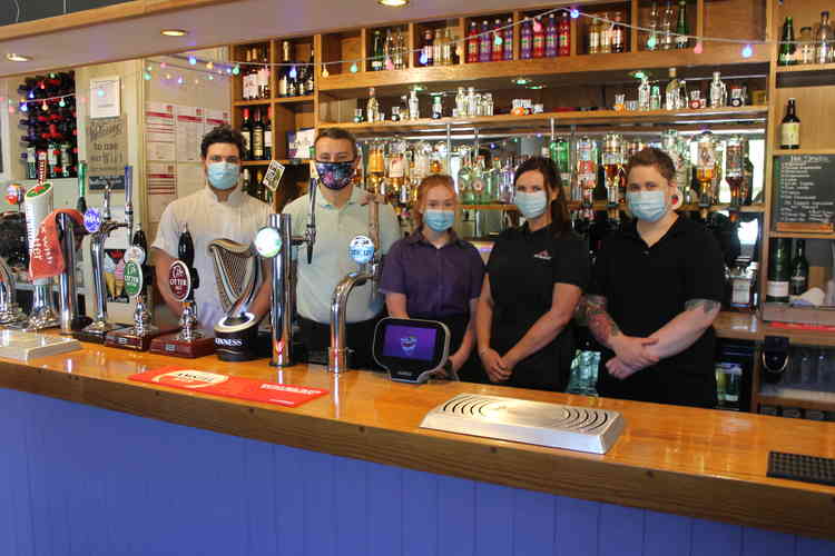 Paige Somers (far right) pictured with bar and kitchen staff at the Hunters Lodge