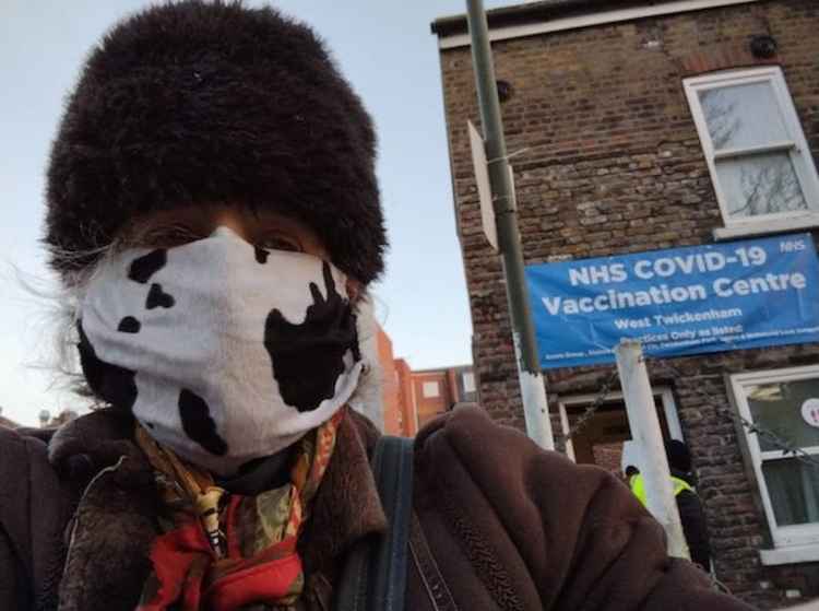 Volunteers like Joan McGalliard braved the cold to help with the vaccination effort