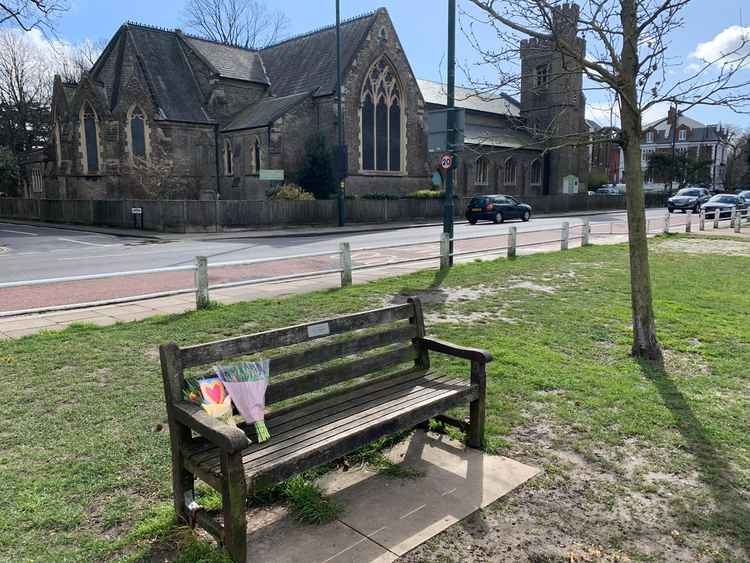 Flowers are being left on the bench dedicated to Amélie Delagrange on Twickenham Green