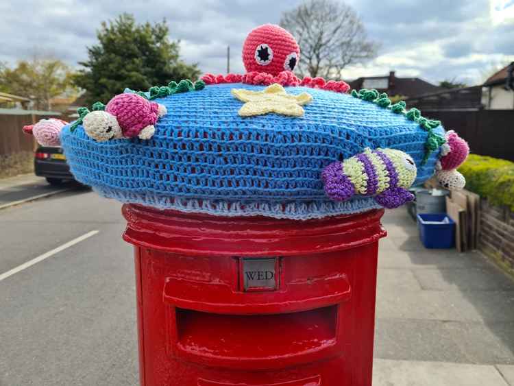 Keeping our postboxes warm with cute crochet hats on Waverly Avenue