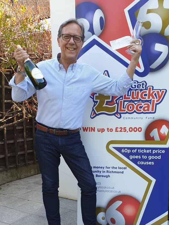 Paul Shields celebrating after his £2000 Get Lucky Local lottery win
