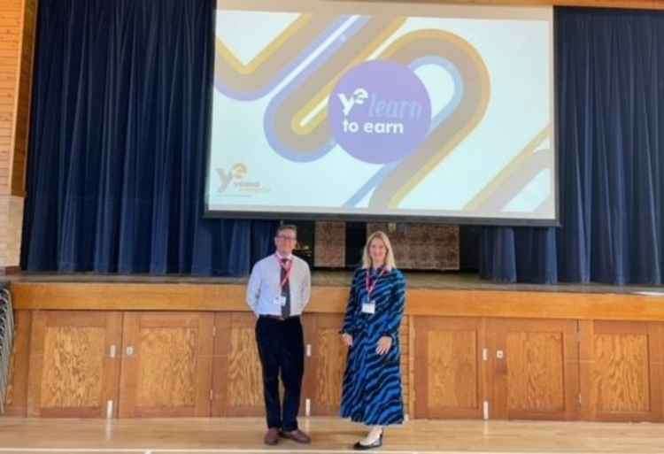 Katie Lovatt and Christopher Hirsch from Holland Hahn & Wills helped run a 'learn to earn' session at St Catherine's school in Twickenham (Credit: Holland Hahn & Wills)