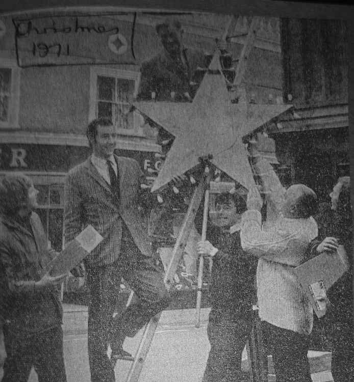 Bob Newbery and other putting up the Christmas lights in Axminster in 1971