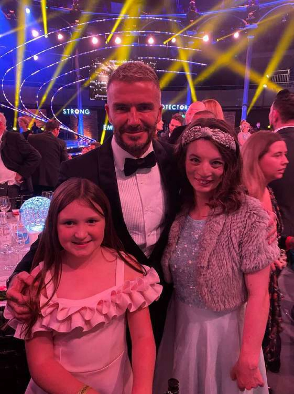Alice O'Rourke (left) and Philippa George (right) from Park Lane Stables get a quick snap with David Beckham at the Who Cares Wins awards last night (Image: Park Lane Stables)