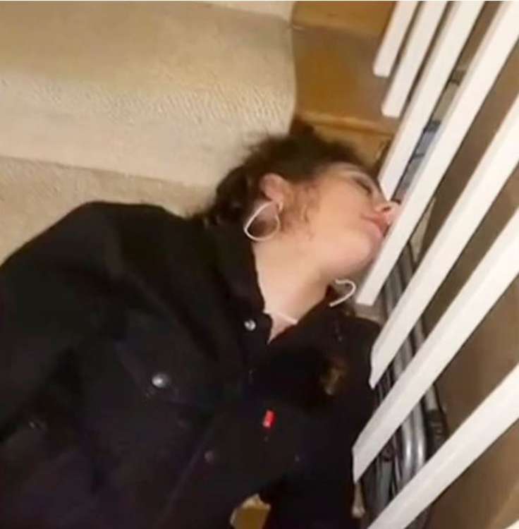 The University of Bristol undergraduate can be seen struggling to get up the stairs