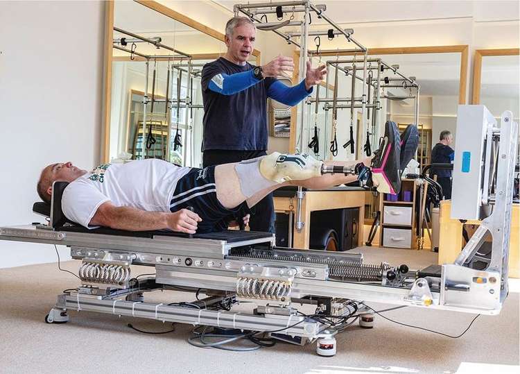 HIFIm inventor John Kennett with one-leg amputee ex-Royal Marine Lee Spencer at the Teddington pilates studios