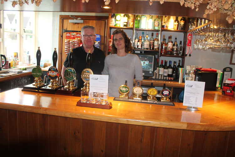 New mine hosts - Georgie Bell and Stephen Clark behind the bar at the New Inn, Kilmington