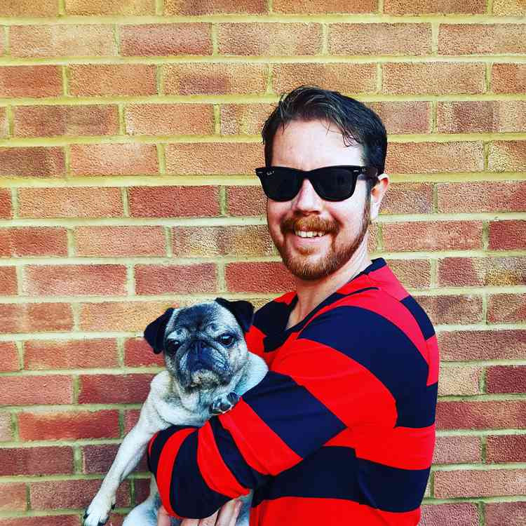 Danny Pearson with his adorable pug Jess, who, along with the town of Hitchin, acts as his 'muse'