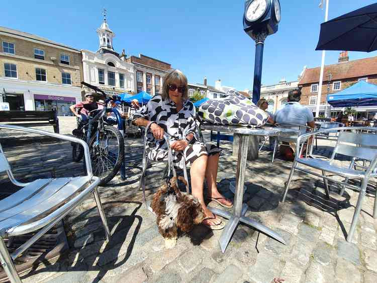 Well-respected Hitchin councillor Judi Billing in Market Place with her dog Pedro. CREDIT: Hitchin Nub News