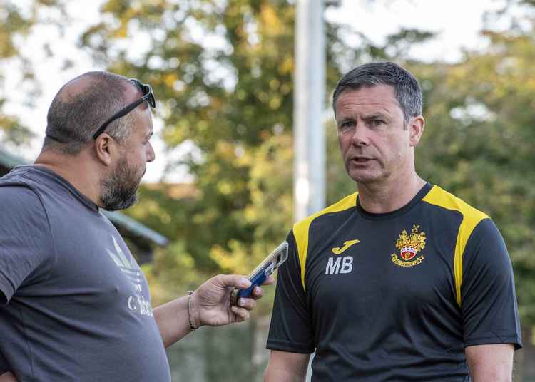Hitchin Town boss Mark Burke in conversation with Hitchin Nub News. CREDIT: PETER ELSE