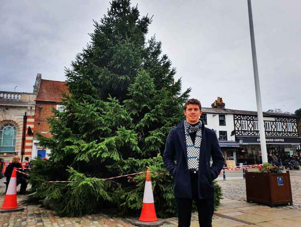 Time to spruce things up - 28ft Christmas tree arrives in Hitchin Market place! PICTURE: Tom Hardy in front of the 28ft tree which will be decorated shortly. CREDIT: Hitchin Nub News