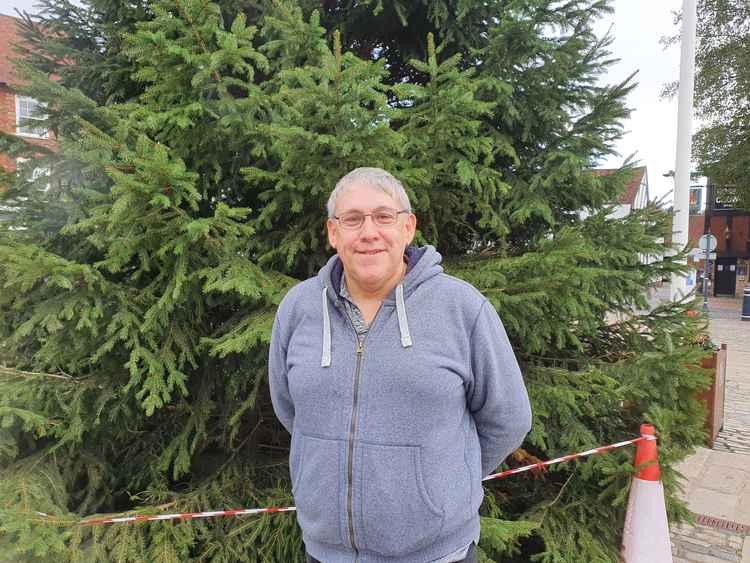 The moving story behind Hitchin's Christmas tree lights. PICTURE: Ian Albert in front of Hitchin's Christmas tree. CREDIT: Hitchin Nub News