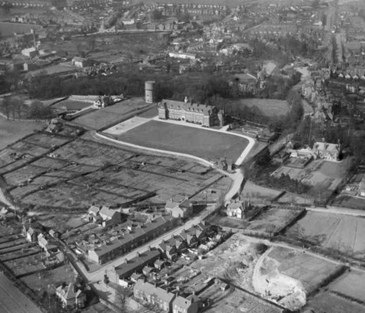 What is now Hitchin Girl's School and how it looked as Hitchin Grammar School in 1924. Note the water tower which still stands today. CREDIT: Britain from Above website