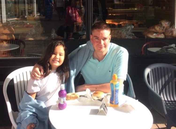 Humble family man Simon Edwards and daughter Kiera. Simon deposited the majority of his winnings into his two daughter's bank accounts after treating himself to 'a beer and a steak' to celebrate. CREDIT: Simon Edwards