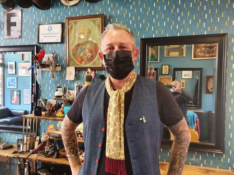 Hitchin hair salon owner Felix says: 'There's definitely a celebratory feel in the air today in Hitchin' as lockdown eases. PICTURE: The charismatic Felix in his salon in Hermitage Road. CREDIT: Hitchin Nub News