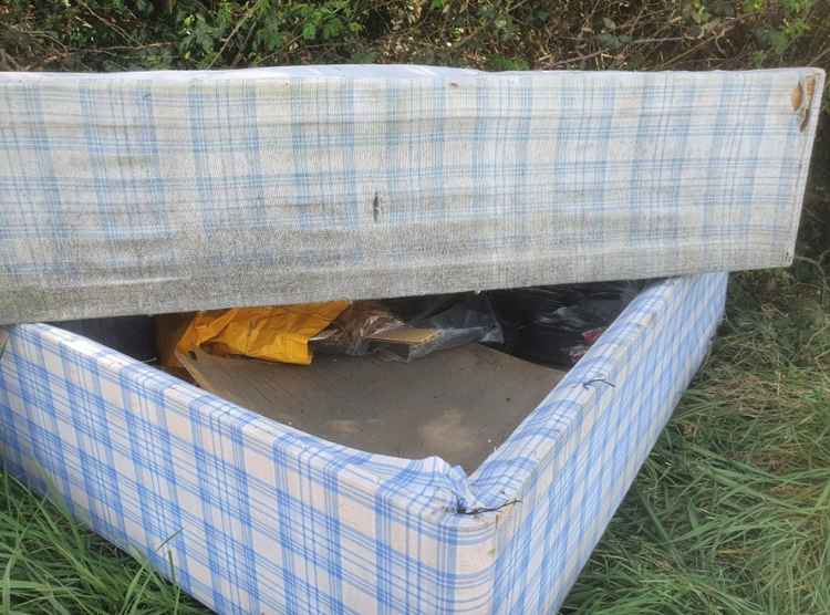 Hitchin: Fly-tipping branded 'disgusting disgrace' as mattresses smelling of urine dumped in beauty spot. CREDIT: @HitchinNubNews