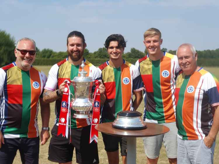 Former Gunner Ian Allinson pictured with the FA Cup last season. Arsenal defender Danny Ballard is second from the right