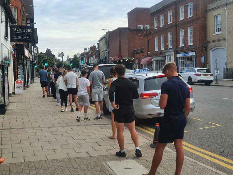 Hungry punters form long queues on Bancroft to sample Chicken George's succulent fayre. CREDIT: @HitchinNubNews