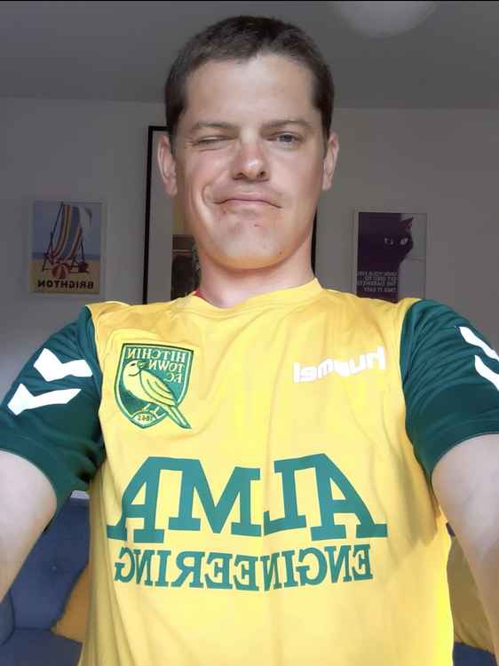 Hitchin Town and England fan and renowned BBC broadcaster Tim Wheeler wears the Canaries acclaimed new shirt.