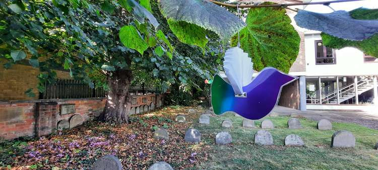 Paper doves made specially for International Peace Day hang in Paynes Park after Tuesday's 'wonderfull' event. CREDIT: Danny Pearson