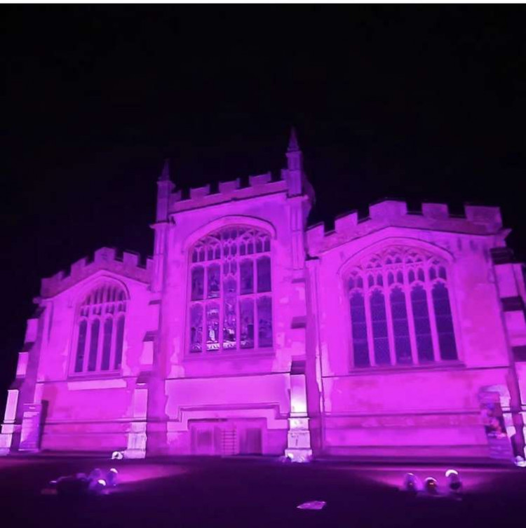 Hitchin: Iconic St Mary's Church bathed in purple light to support World Polio Day. CREDIT: Danny Pearson