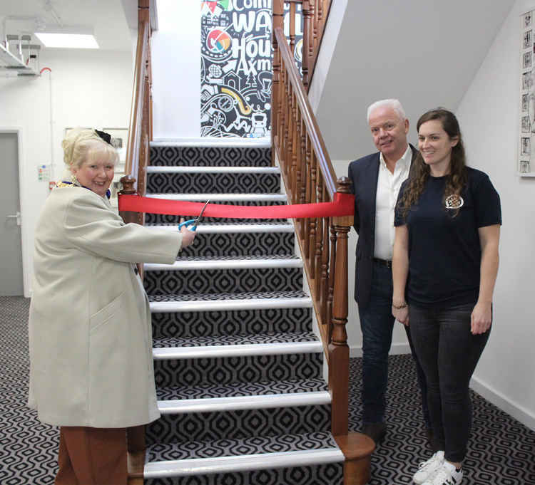 Anni Young (left) pictured just a few weeks before her sudden death at the opening of the Community Waffle House, where the defibrillator and plaque in her memory are now installed