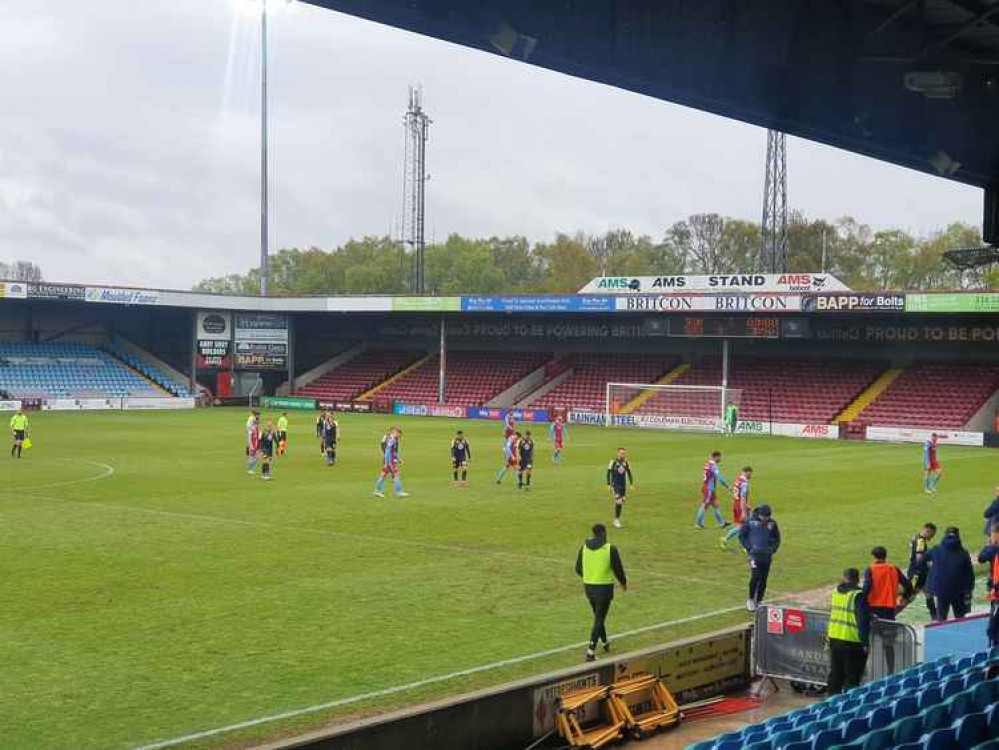 Stevenage travelled to Scunthorpe for their final League Two game of the 2020-21 season. PICTURE: The teams at Glanford Park. CREDIT: @laythy29