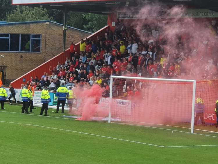 Stevenage 1-1 Swindon Town: Late penalty spoils Boro's day after crowd disturbances in away end. PICTURE: Smoke bombs were thrown from the away end with seats and advertising hoardings ripped up. CREDIT: @laythy29