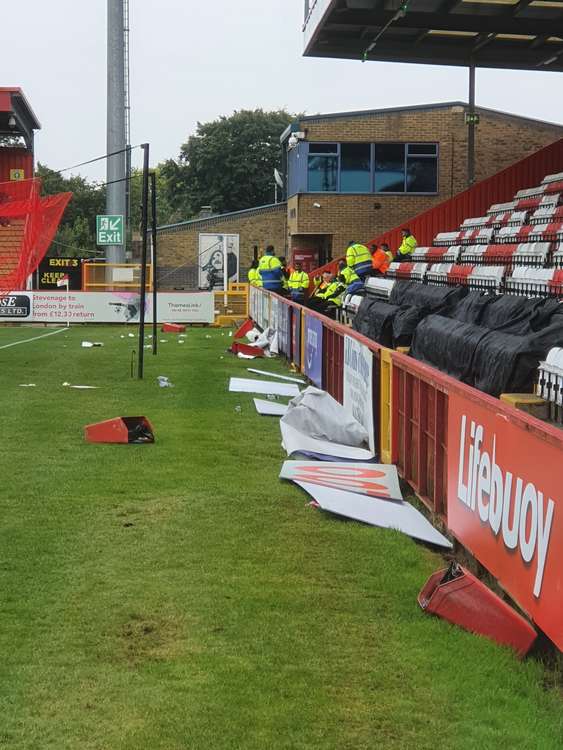 Advertising hoardings, seats, bins and other detritus that were hurled onto the pitch during the game from the away end following disturbances between a number of travelling fans and stewards. CREDIT: @laythy29