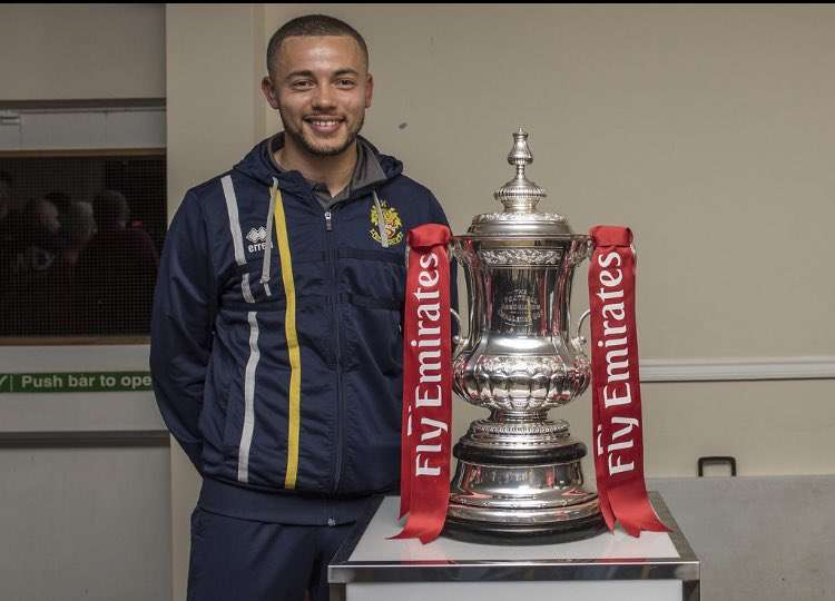 PICTURE: Michael Johnson with the FA Cup when the BBC visited Top Field to screen the draw from the Canary Club during the stirring 2018 run to the first round. CREDIT: Hitchin Town club photographer Peter Else