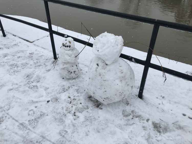 Snowmen on the river