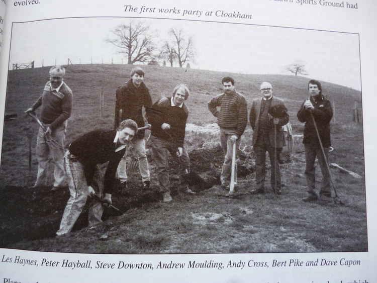 A work party bringing the new water supply into the site at Cloakham Lawns