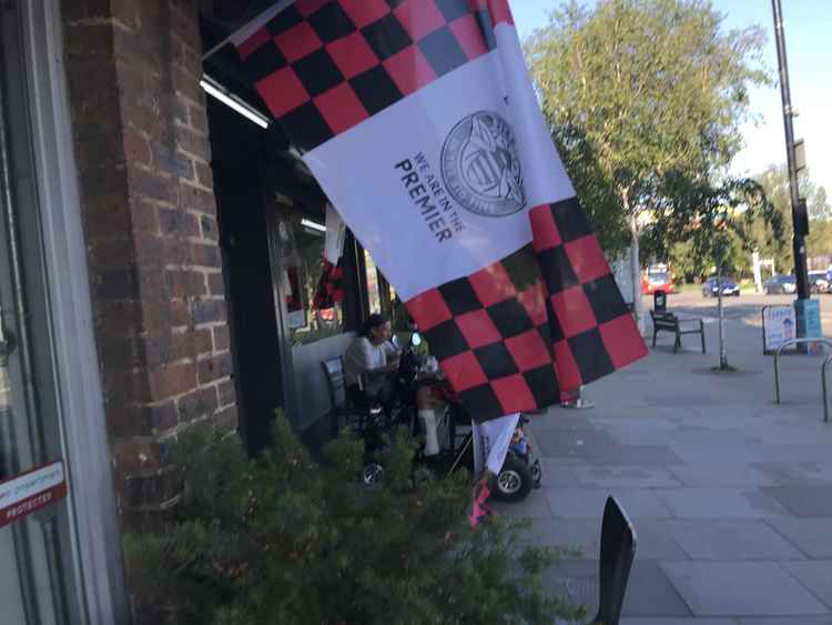 Flags adorned local bars and cafes