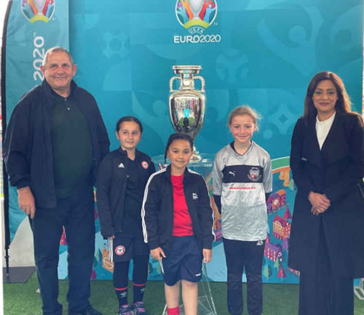 Hounslow Council leader, Steve Curran, with Councillor Samia Chaudhary and members of the local Wildcats at the men's trophy display. Image Credit: Hounslow Council