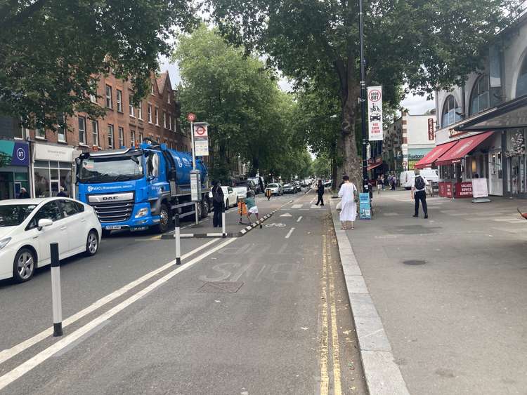 The two-way cycle lane occupies what was once a lane for cars and buses, creating bus stop islands. Image Credit: Josh Mellor