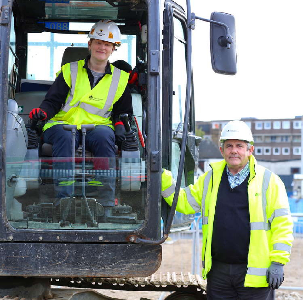 Councillor Dune (in digger) with Councillor Curran at the site in Brentford. (Image: Hounslow Council)