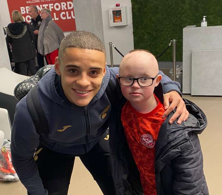 Woody went in for a hug with England player Max Aarons after Saturday's Brentford match. (Image: Natalie O'Rourke)